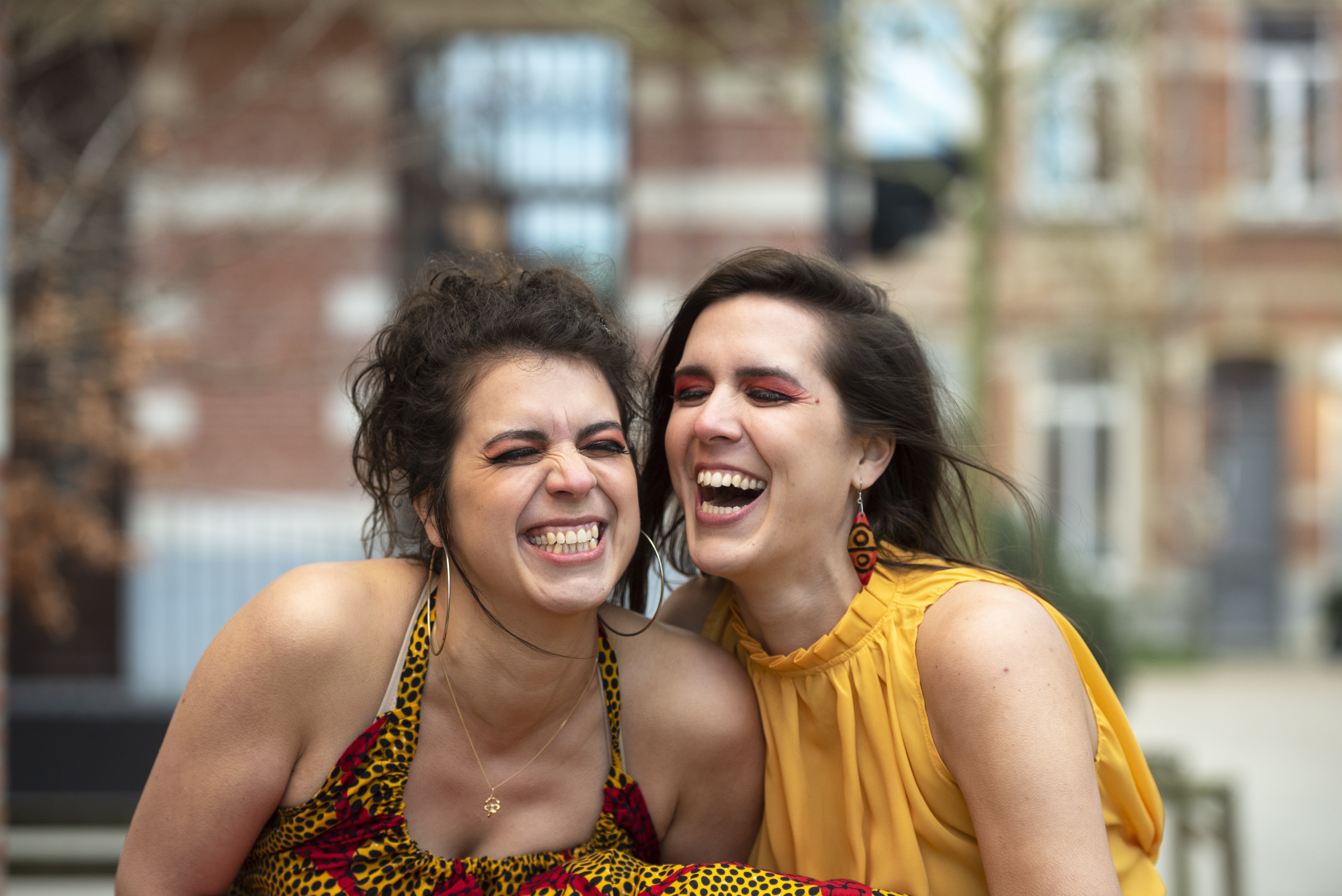 Morgane and Alissia from Lyonesse laughing candidly during an EP cover photoshoot.